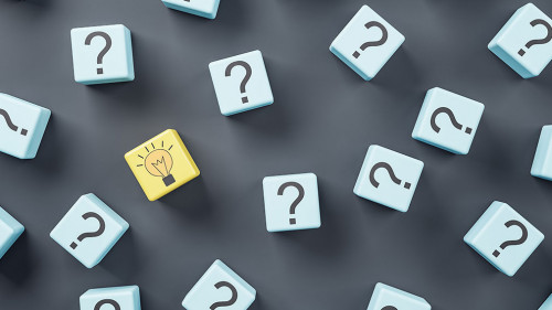 Idea concept with blue wooden cubes with question sign and one yellow with light bulb on dark background