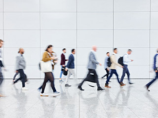 Anonymous crowd of business people on trade fair