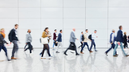 Anonymous crowd of business people on trade fair