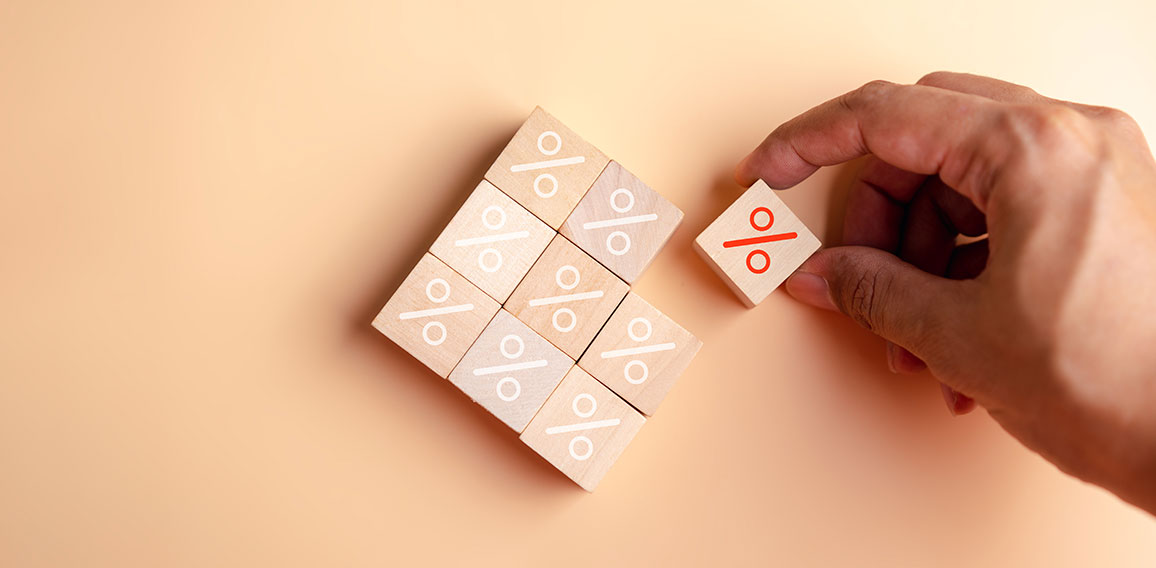 Percentage sign of hand arranging wood blocks stacking as step stair with percent symbol,  interest rate and business profit growth concept.