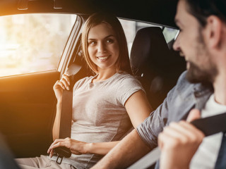 Couple at car dealership