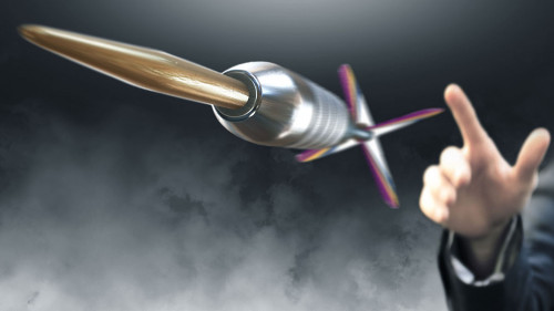 Man throwing dart to an objective