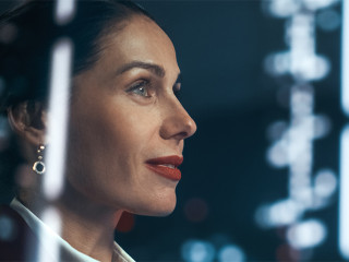 Successful Businesswoman in Stylish Suit Working on Top Floor Of