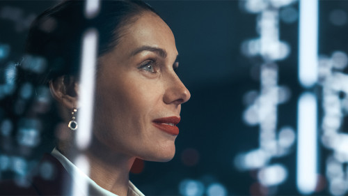 Successful Businesswoman in Stylish Suit Working on Top Floor Of