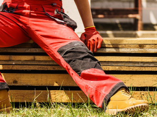 Person wearing red worker trousers