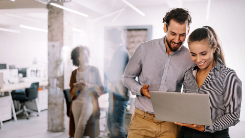 Happy young business people colleagues talking working in office