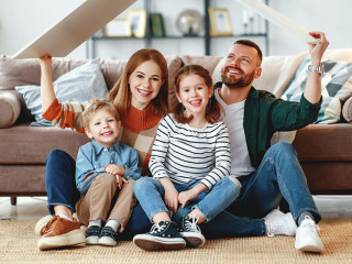 concept housing a young family. mother father and children in  new home