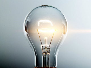 Glowing yellow light bulb, busienss idea concept