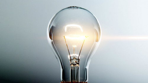 Glowing yellow light bulb, busienss idea concept