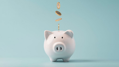 Coins falling to white piggy saving , Financial and money depos