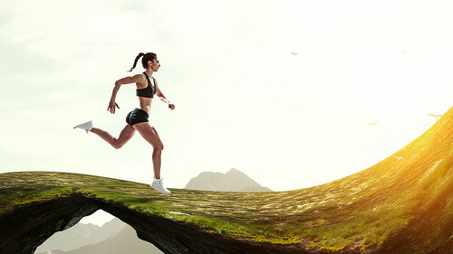 Woman running against natural landscape background