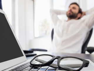 A businessman relaxing in his chair