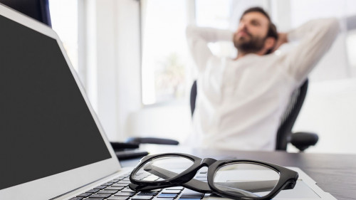 A businessman relaxing in his chair