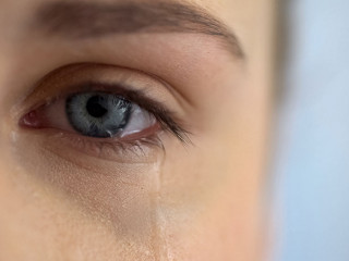 Sad woman crying, suffering pain eyes full of tears, domestic vi