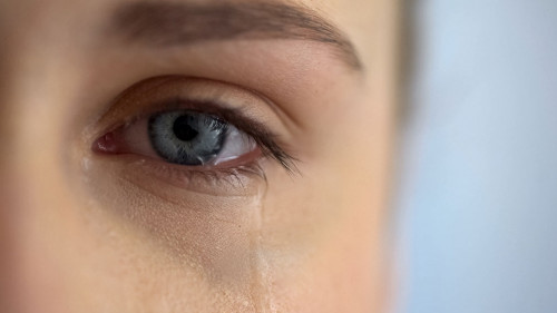 Sad woman crying, suffering pain eyes full of tears, domestic vi