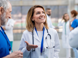 Group of doctors on conference, medical team discussing issues.