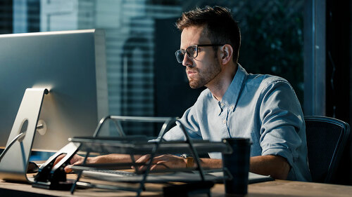 Man working late at night in office