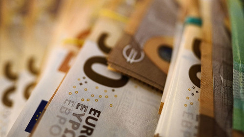Bundled euro banknotes with selective focus