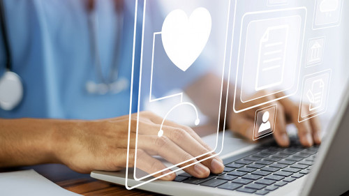 Doctor using technology document management on computer system m