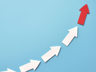 Many white arrows follow one red arrow. Symbol of following the