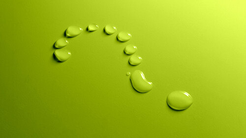 Water drops question mark on green background