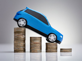Blue Car Over Stacked Coins