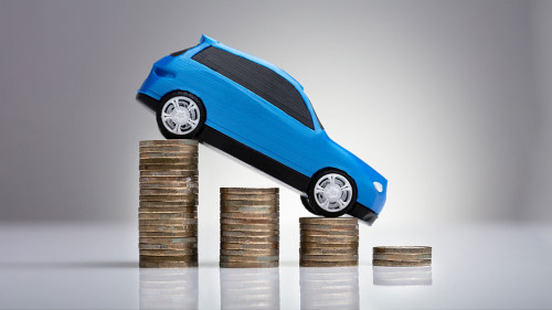 Blue Car Over Stacked Coins