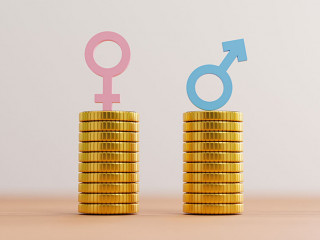 Blue sign of man on coins stacking equality with pink woman sign