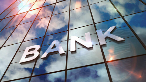 Bank glass skyscraper with mirrored sky