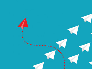 Red paper plane out of line with white paper to change disrupt a