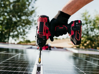 close up hand of mature Technician man assembling solar panels w