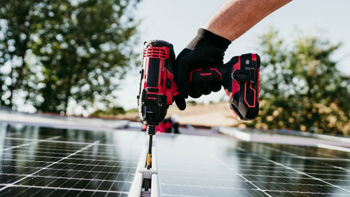 close up hand of mature Technician man assembling solar panels w