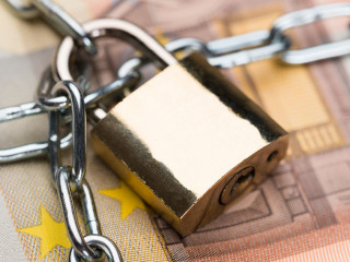 Chain And Padlock Around Euro Banknotes