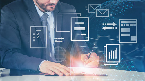 Businessman writing in office, electronic document