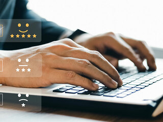 Businessmen are choosing screen on the happy Smiley face icon to