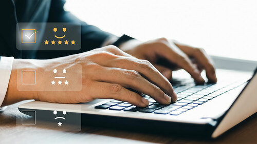 Businessmen are choosing screen on the happy Smiley face icon to