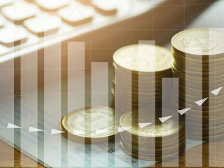 money coins stacked with calculator on book bank and capital fin