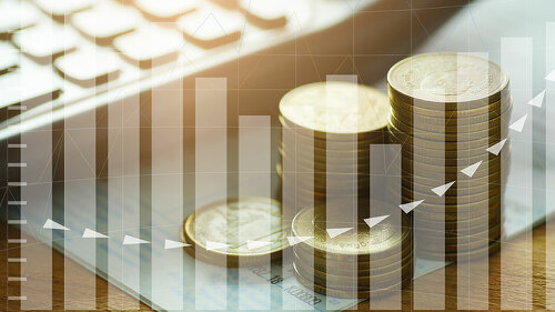 money coins stacked with calculator on book bank and capital fin