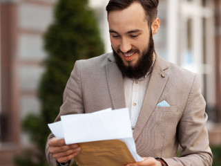 Positive notice of a successful trial by mail. Happy man with a