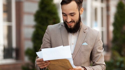 Positive notice of a successful trial by mail. Happy man with a