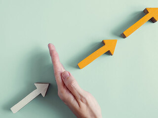Hand blocking the growth arrows, managing impacts of Covid-19 GD