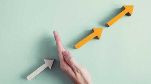 Hand blocking the growth arrows, managing impacts of Covid-19 GD