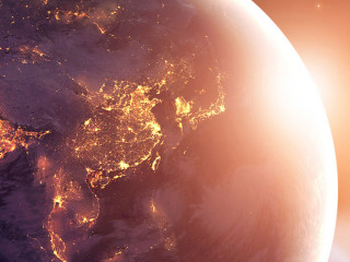 Earth at night was holding in human hands. Earth day. Energy sav