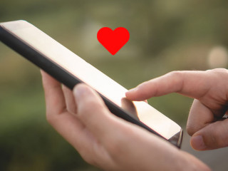 Woman hand use smartphone in public area with 1 new email alert