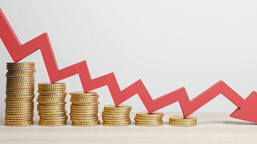 Inflation and global economy crisis concept with red arrow going down on golden coin stacks. 3D rendering