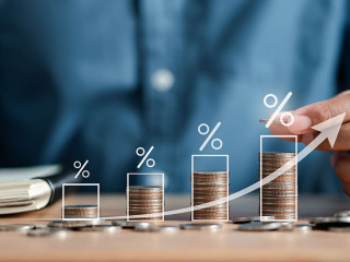 Businessman stacking money coins accounting for increase financial interest rate and business investment growth from dividend, Business Finance and Money, Save money for prepare in the future.