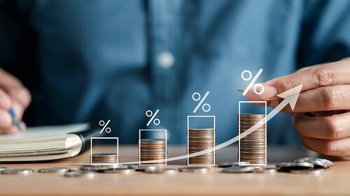 Businessman stacking money coins accounting for increase financial interest rate and business investment growth from dividend, Business Finance and Money, Save money for prepare in the future.