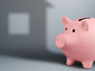 Piggy bank with shadow as house,housing industry finance concept