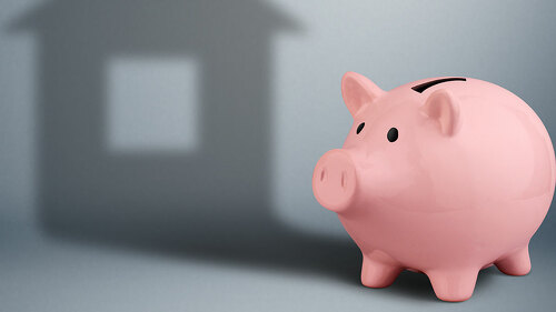 Piggy bank with shadow as house,housing industry finance concept