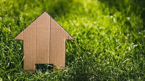 green home and eco-friendly construction, house icon on green gr